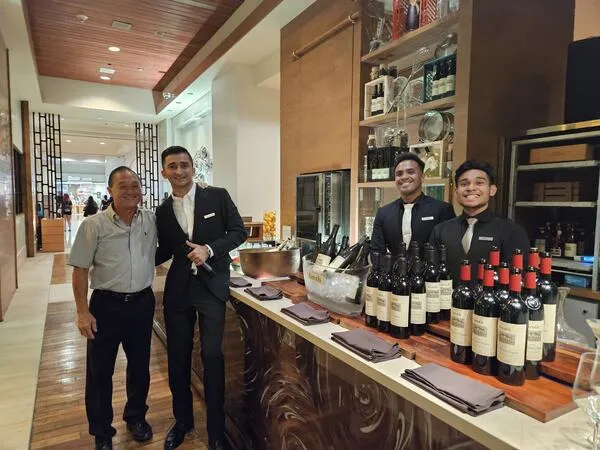 The team pouring at a hotel tasting