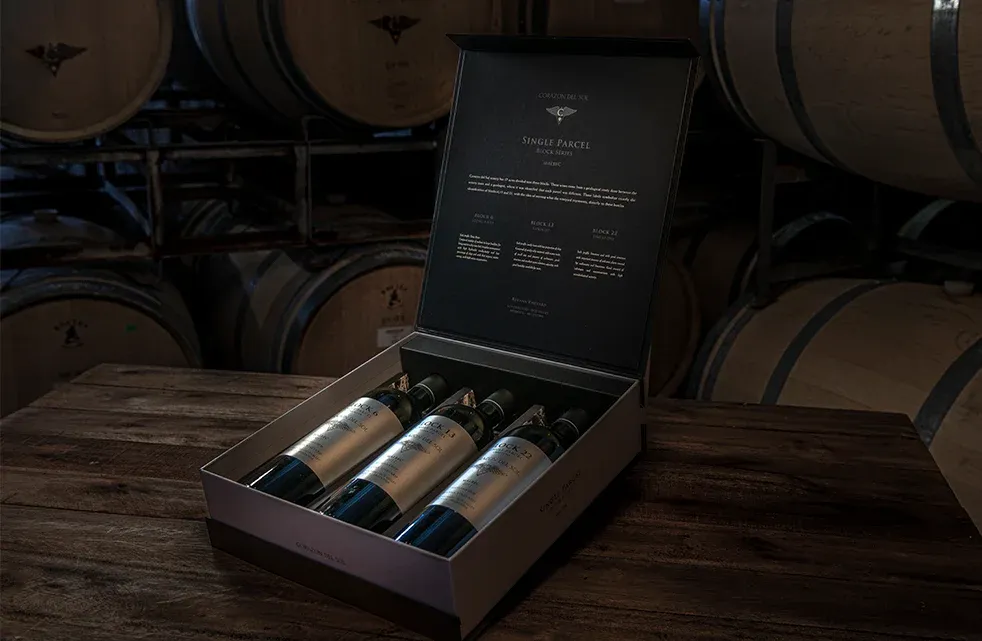 Corazón del Sol wines in a presentation box in the barrel room