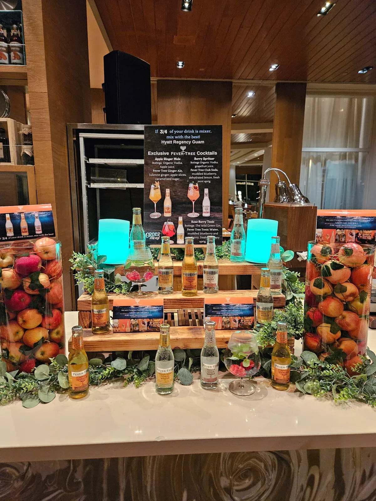 The Fever-Tree display at the Hyatt, with mixers among baskets of fruit beneath the cocktail menu