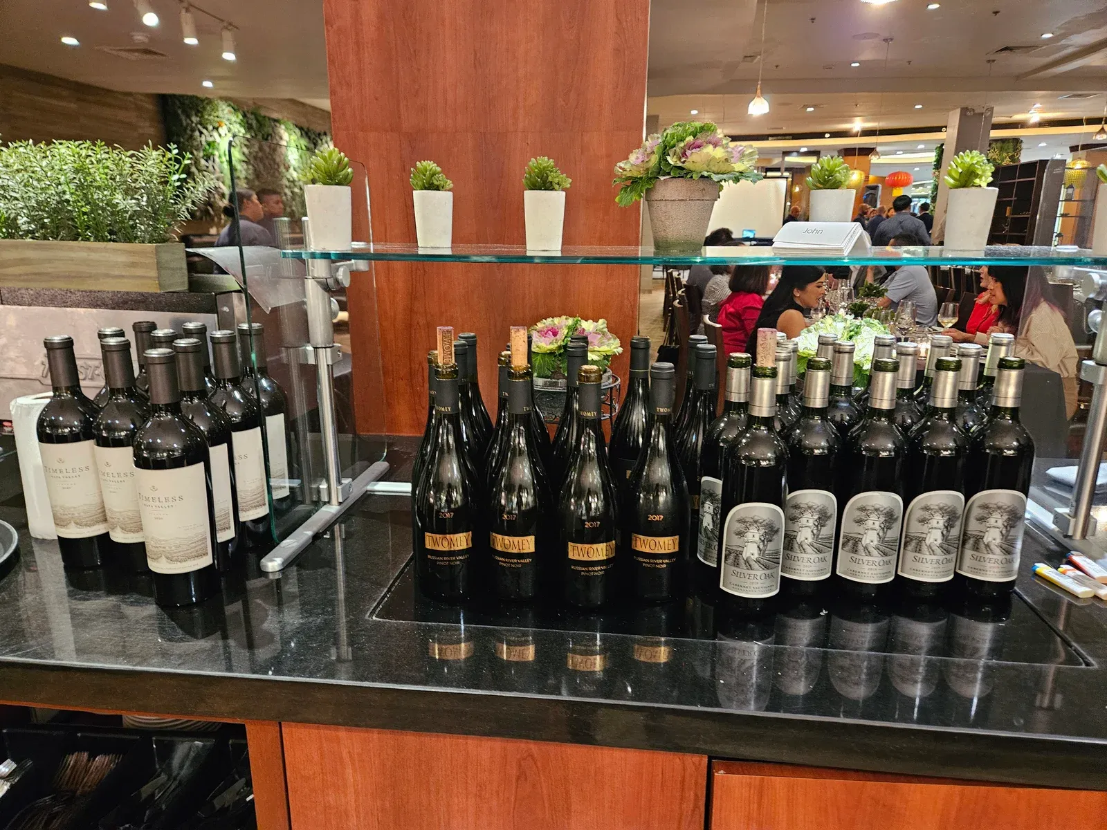 Rows of Silver Oak Cabernet Sauvignon bottles on display at the Root’z wine dinner