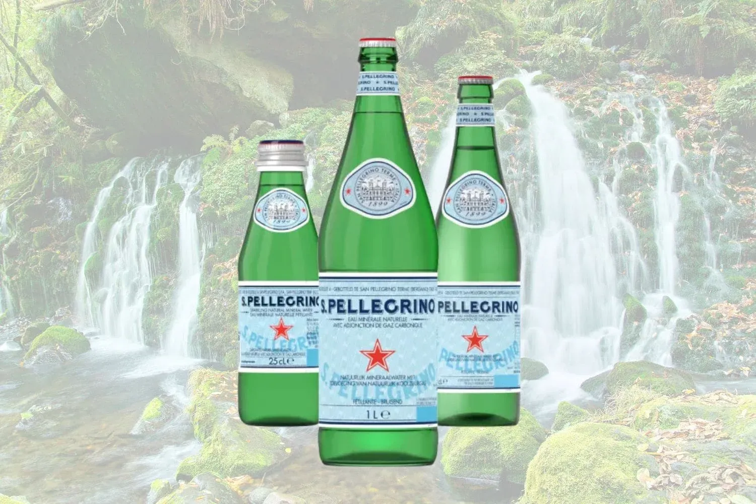 S.Pellegrino sparkling water in three glass bottles of different sizes in front of a forest waterfall