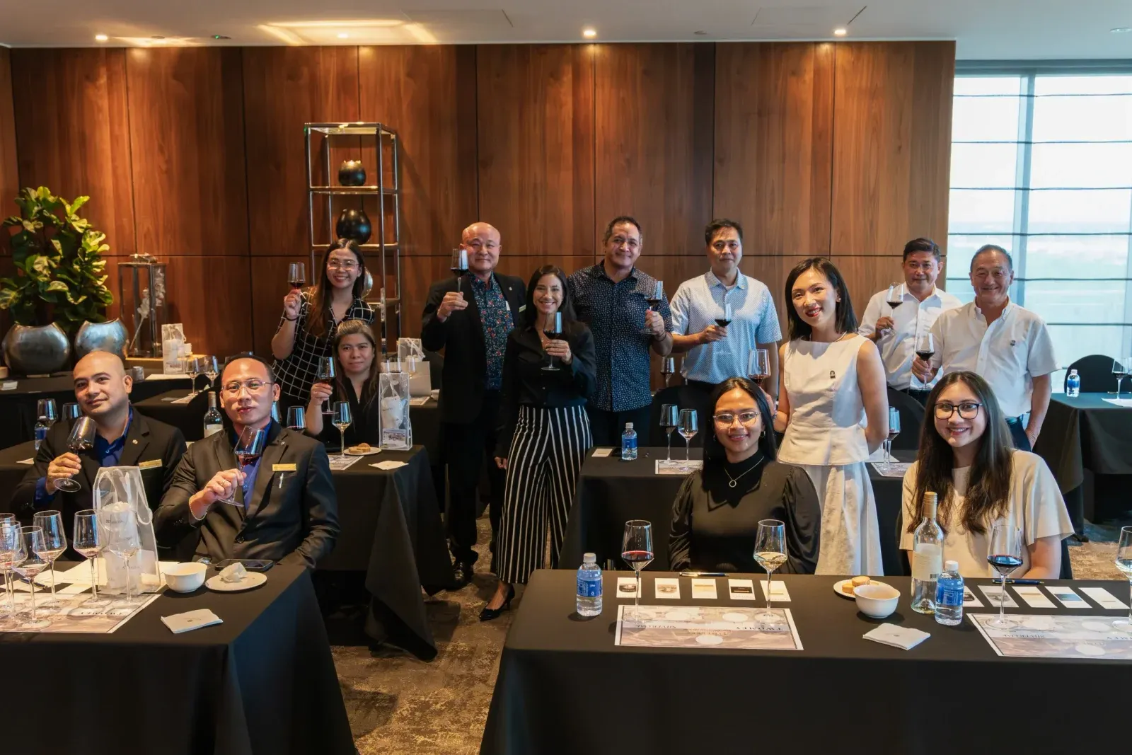 Masterclass guests raising their glasses at The Tsubaki Tower